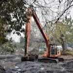 Workers busy in cleaning the Canal with the help of Machinery near Mall road in the Provincial Capital