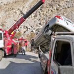 Rescue 1122 staffer busy in lifting car from the ditch after road accident