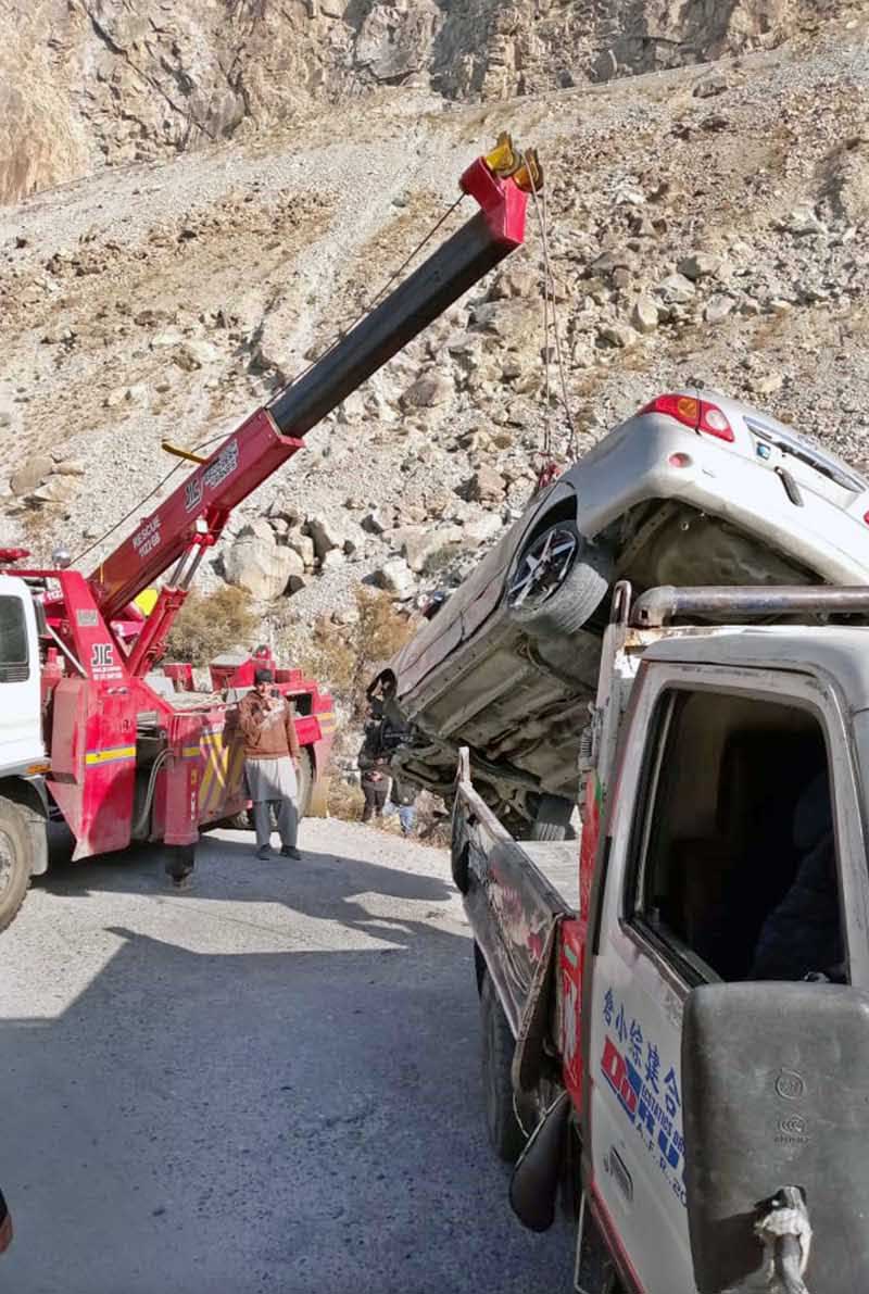 Rescue 1122 staffer busy in lifting car from the ditch after road accident
