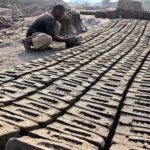 A labourer busy in work at a local bricks kiln