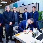 Caretaker Prime Minister Anwaar-ul-Haq Kakar records his remarks in the visitor's book in the Business Facilitation Center.