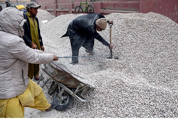 Laborers busy in work at Girls College Road.