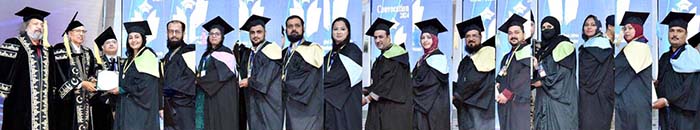 President Dr. Arif Alvi conferring degrees and gold medals upon the graduates of Allama Iqbal Open University (AIOU) during its convocation ceremony at Jinnah Convention Centre.