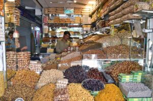 A vendor selling dry fruits at his shop as per increased demand in winter season in a local market of Provincial City. 