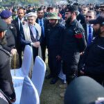 Caretaker Prime Minister Anwaar-ul-Haq Kakar interacts with KP Police officials after the Police Darbar Ceremony