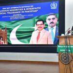 Caretaker Federal Minister of Religious Affairs & Inter faith Harmony Aneeq Ahmed addressing as seminar on Religious Minorities and Interfaith Social Tolerance in Pakistan at IQRA University.
