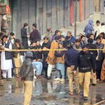 Rescue officials engage in fire extinguishing operation in Time Center mobile market at Saddar area