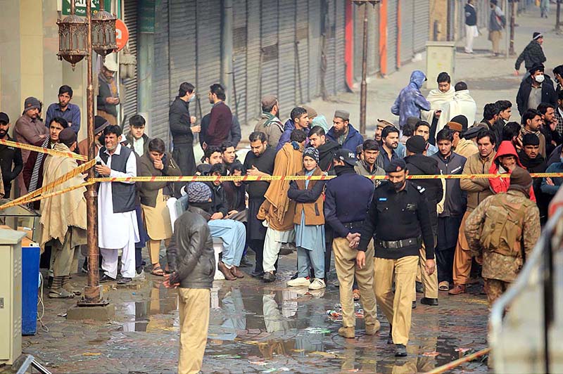 Rescue officials engage in fire extinguishing operation in Time Center mobile market at Saddar area
