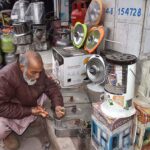 Worker repairing Gas stove at his workshop