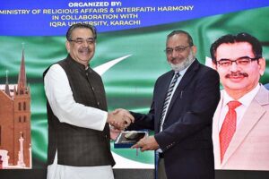 Caretaker Federal Minister of Religious Affairs & Inter faith Harmony Aneeq Ahmed addressing as seminar on Religious Minorities and Interfaith Social Tolerance in Pakistan at IQRA University.
