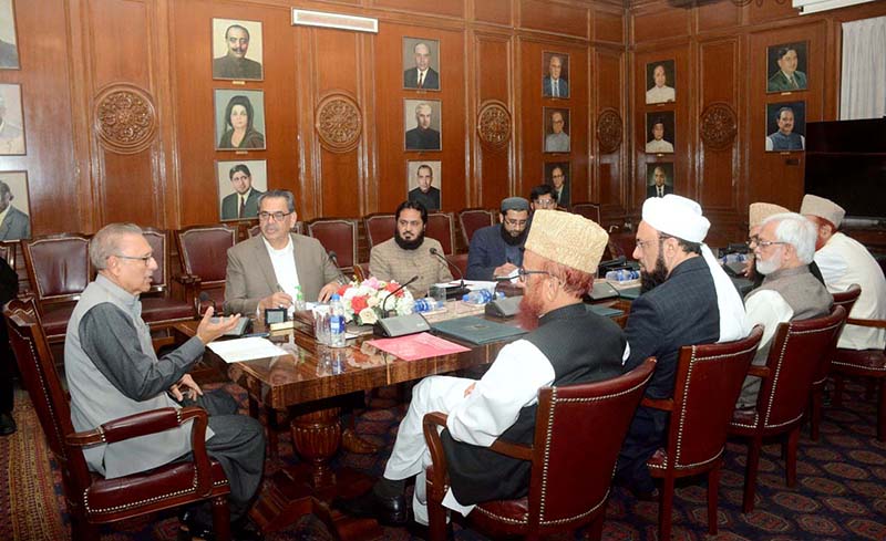 President Dr Arif Alvi chairing a meeting on the role of Masajid and Madaris in promoting education and creating awareness about health issues, at Governor House