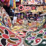 A vendor preparing the different kinds of decorative stuff using during marriage ceremonies at his workplace.
