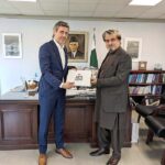 Caretaker Federal Minister for National Heritage and Culture Jamal Shah presenting CPEC Cultural Caravan book to Director and Representative UNESCO Dr. Youssef Filali-Meknassi after meeting in his office.