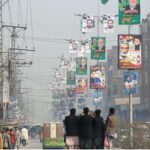 A view of different political parties banners displayed on street lights for upcoming General Election-2024 at Dalazak Road