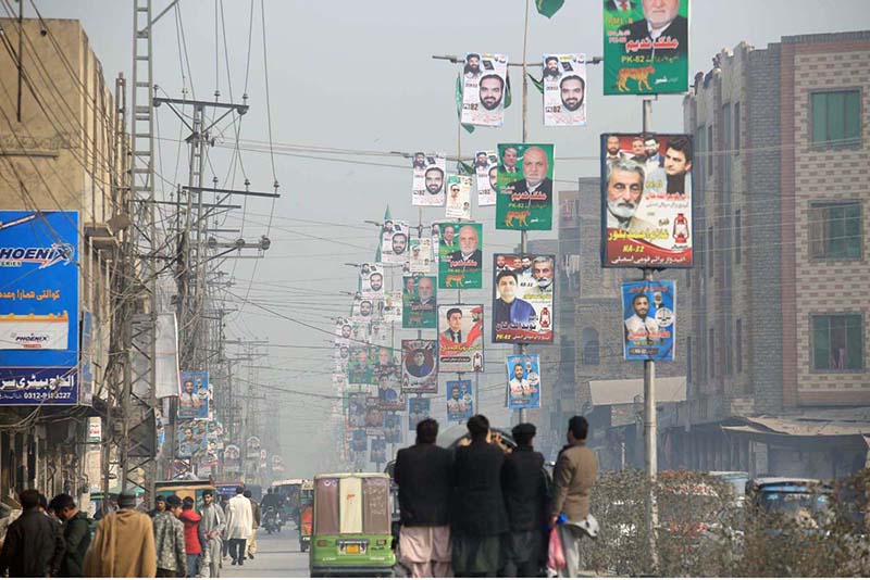 A view of different political parties banners displayed on street lights for upcoming General Election-2024 at Dalazak Road