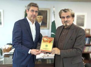 Caretaker Federal Minister for National Heritage and Culture Jamal Shah presenting CPEC Cultural Caravan book to Director and Representative UNESCO Dr. Youssef Filali-Meknassi after meeting in his office.