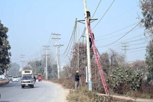 IESCO workers repair the electric line at Park Road in Federal Capital