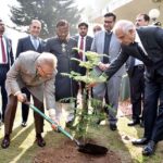 President Dr Arif Alvi planting a sapling during his visit to Federal Tax Ombudsman Office