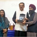 Caretaker Federal Minister of Religious Affairs & Interfaith Harmony Aneeq Ahmed distribution shield during seminar on "Bridging Belief: Interfaith Harmony in Pakistan" at Dawood University of Engineering and Technology