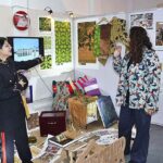 Visitors viewing creative work during 18th Annual Degree Show at SABS University of Art, Design and Heritages Jamshoro.