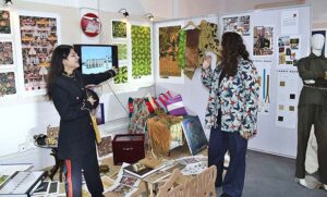 Visitors viewing creative work during 18th Annual Degree Show at SABS University of Art, Design and Heritages Jamshoro. 