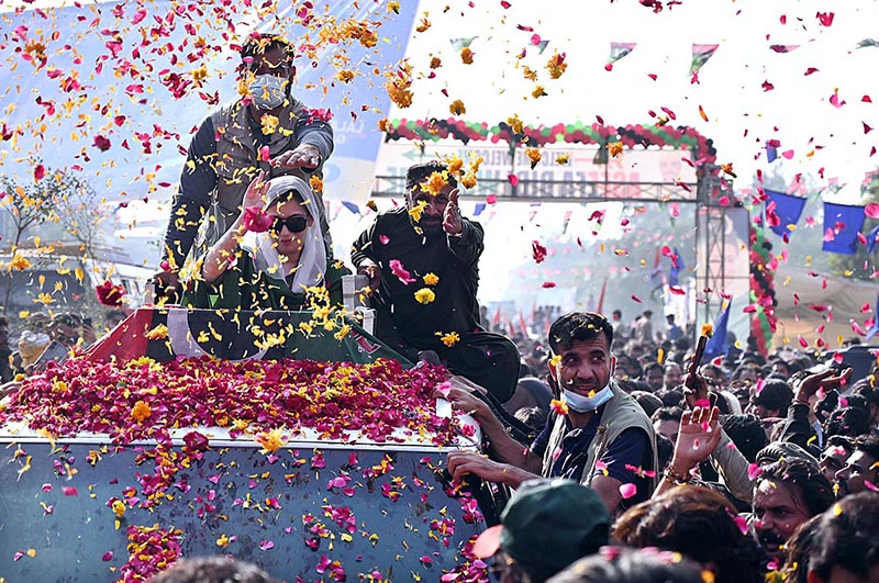 PPP workers showering flower petals on Pakistan People’s Party leader Aseefa Bhutto Zardari during general election campaign rally at Qasimabad