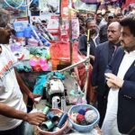 Governor Sindh Kamran Tessori talking with shopkeeper during his visit Shama Shopping Center and Resham Bazaar of Shah Faisal Colony
