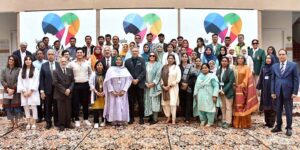 President Dr. Arif Alvi and the First Lady Begum Samina Arif Alvi in a group photo with organizers and staff at Society for Children in Need Of Special Attention (SCINOSA)