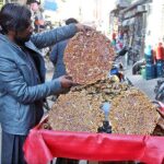 A vendor displaying sweets (lahi) to attract customers