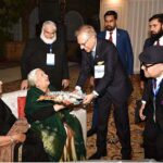 President Dr. Arif Alvi presenting flowers to his teachers at the annual union of Old Publicans