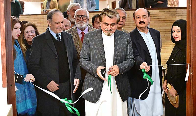 Caretaker Federal Minister for National Heritage and Culture Division Jamal Shah cutting ribbon to inaugurate calligraphic exhibition titled "Mashq-e-Ishq" by Gen. (R) Humayun Khan Bangash at PNCA