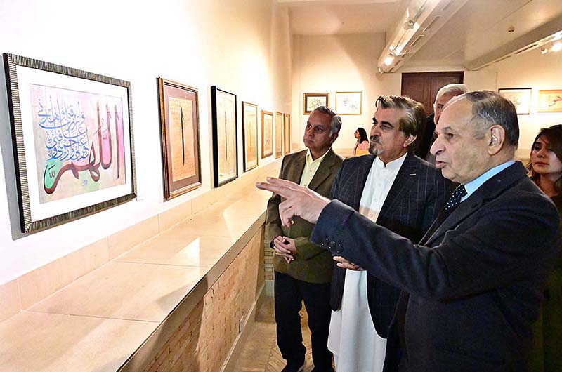 Caretaker Federal Minister for National Heritage and Culture Division Jamal Shah cutting ribbon to inaugurate calligraphic exhibition titled "Mashq-e-Ishq" by Gen. (R) Humayun Khan Bangash at PNCA