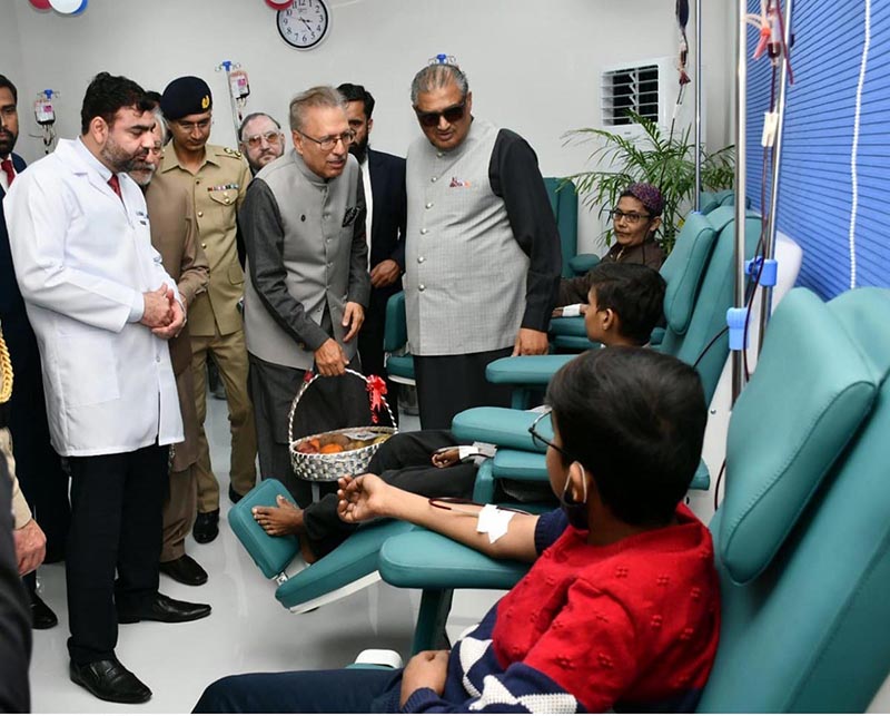 President Dr. Arif Alvi enquiring after the health of patients during his visit to the Sundas Foundation Karachi Centre, providing blood and hematological services to patients
