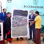 Students of BNU present Caretaker Prime Minister Anwaar-ul-Haq Kakar with a painting as a souvenir.