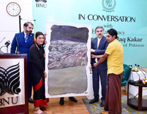 Students of BNU present Caretaker Prime Minister Anwaar-ul-Haq Kakar with a painting as a souvenir. 
