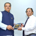 Caretaker Federal Minister for Religious Affairs and Interfaith Harmony Aneeq Ahmed is being presented with memento during the Seerat-un-Nabi Conference at Iqra University Karachi.