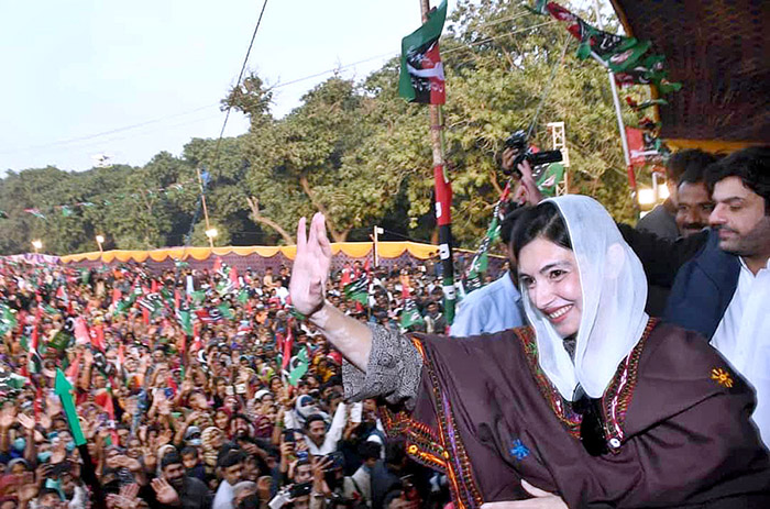 Leader of People’s Party, Miss Asfa Bhutto Zardari responding to the workers' slogans by waving hand during election campaign in public meeting at Shahpur Rizi Village.