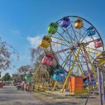 People enjoying mechanized swing at Lake View Park in Federal Capital.