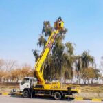 CDA staffer busy installing new street lights near Faizabad in the Federal Capital.