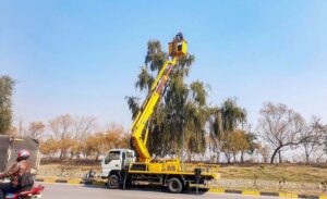 CDA staffer busy installing new street lights near Faizabad in the Federal Capital. 
