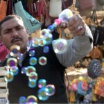A vendor selling water bubble gun at Lake View Park
