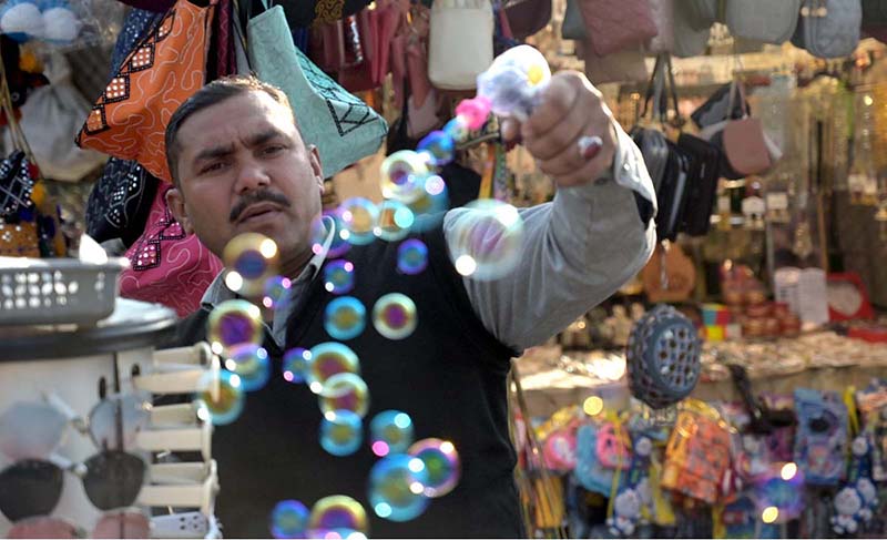 A vendor selling water bubble gun at Lake View Park