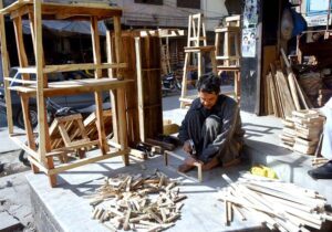 Artisan busy making wooden bench at Banni Chowk