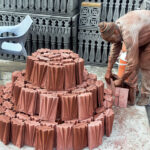 Labourer busy displaying tuff tiles at IJP Road in the Federal Capital.