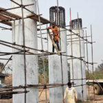 Labourers busy construction work of bridge at IJP Road in the Federal Capital.