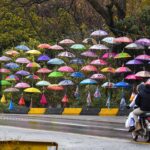 A vendor displaying colorful umbrellas at Satra Meel to attract the customers.