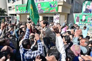 PML-N candidate Anjum Aqeel Khan with supporters celebrates after won the election for National Assembly constituency NA-46 Islamabad Capital Territory according to the unofficial result.