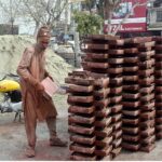 Labourer busy in making tuff tiles at IJP Road in the Federal Capital.