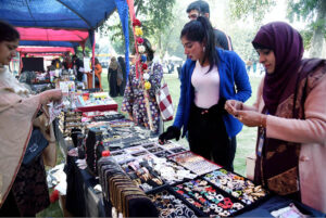 Women visiting stall during Faiz Mela at Al-Hamra