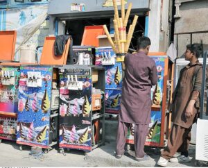 A mechanic busy in repairing ice cream machine at his workplace.